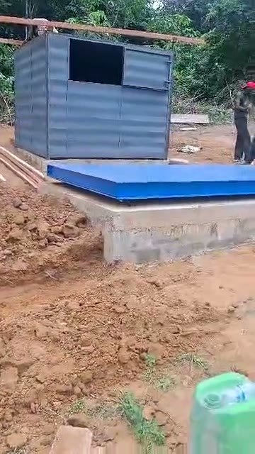 Weighbridge on its foundation with weighing cabin